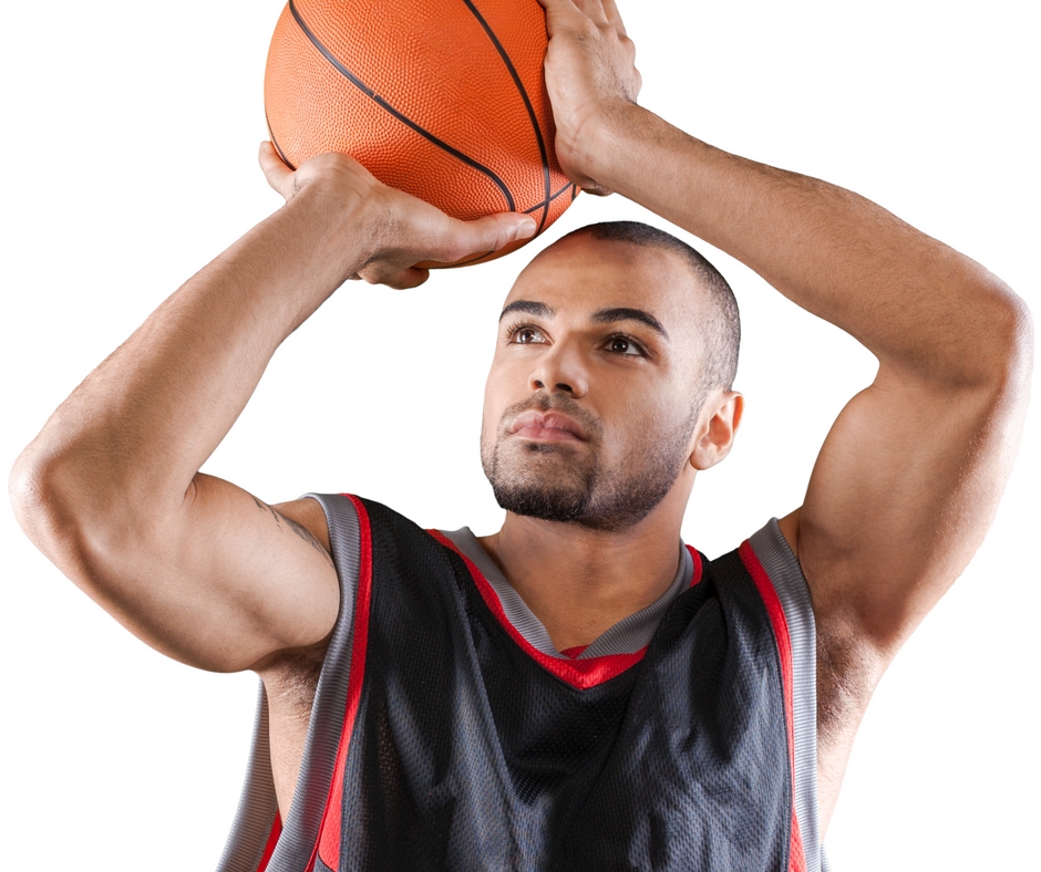 Young man shooting a basketball