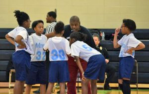 image of children playing basketball