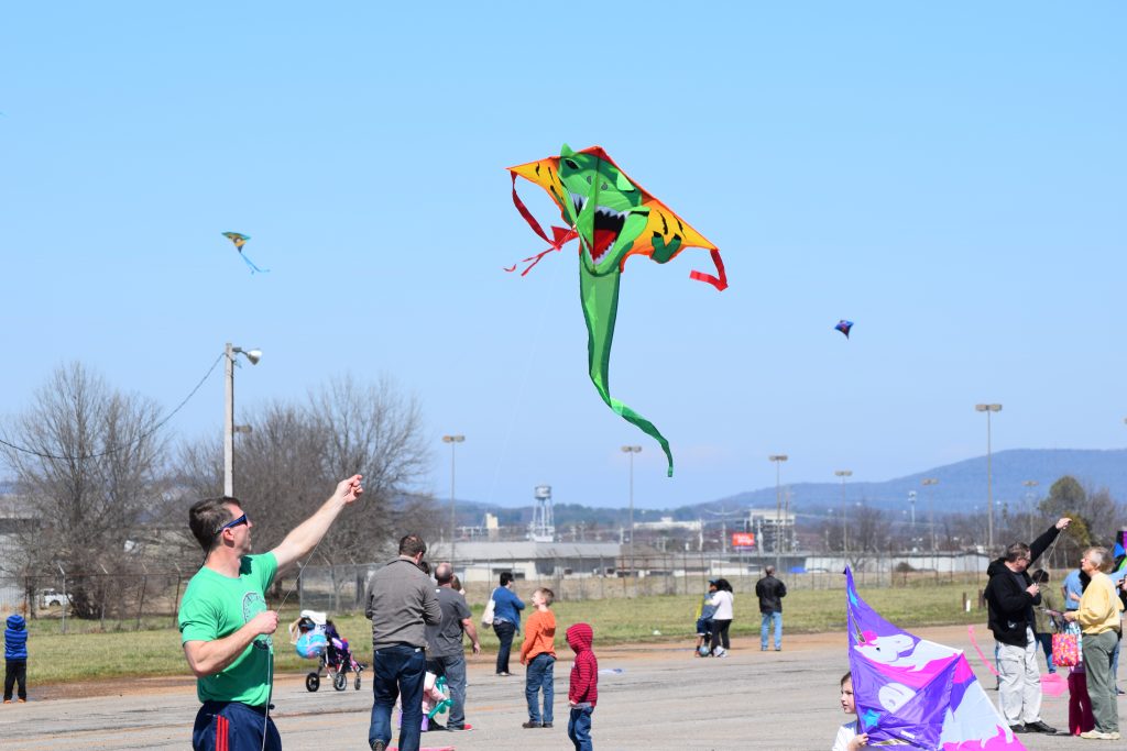 Families flying kites at the Jaycee Festival Grounds