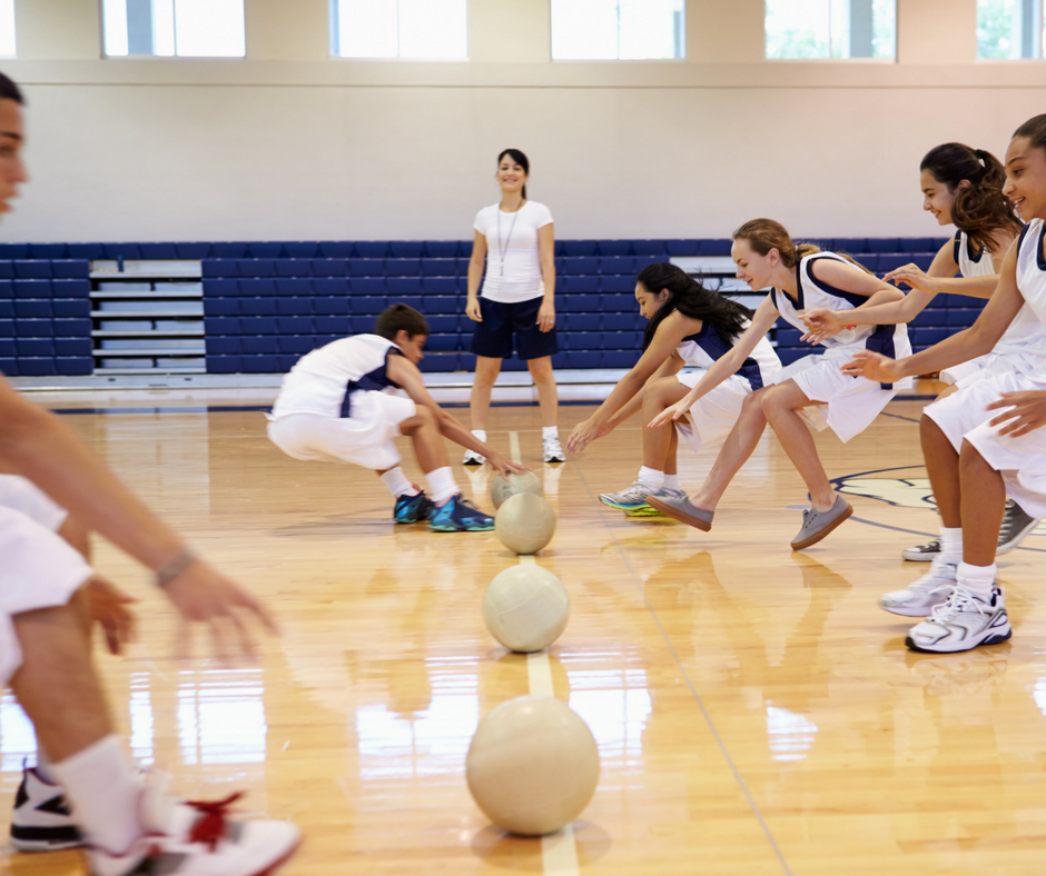 teenagers playing dodge ball