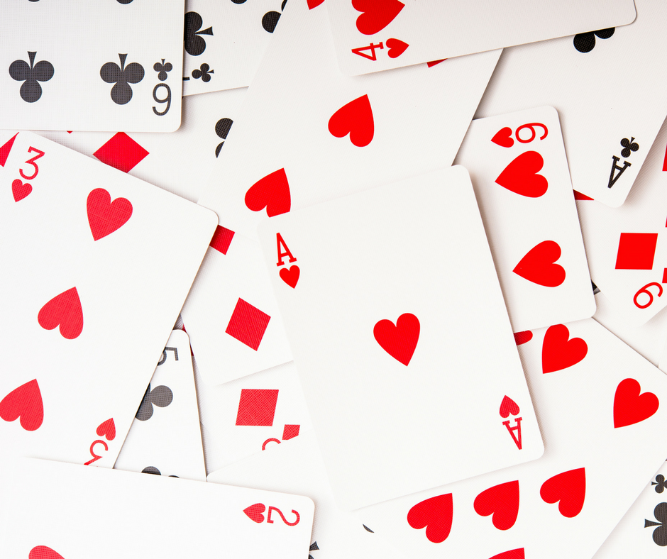 playing cards scattered on a table