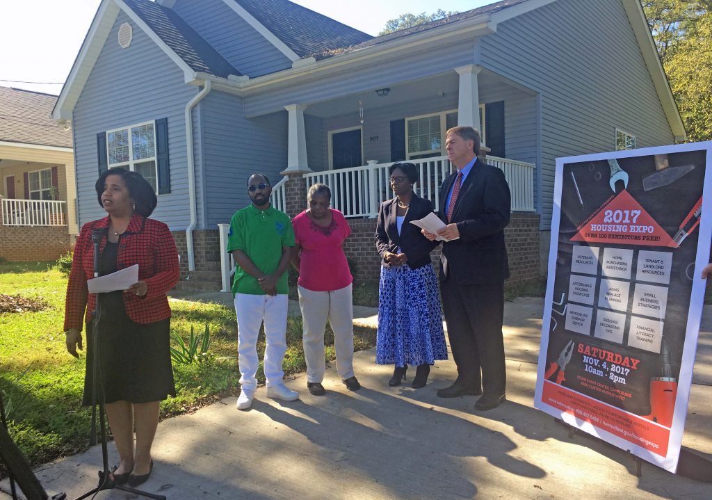 Community Development and Mayor Battle at the home of woman who received assistance to purchase her first home.