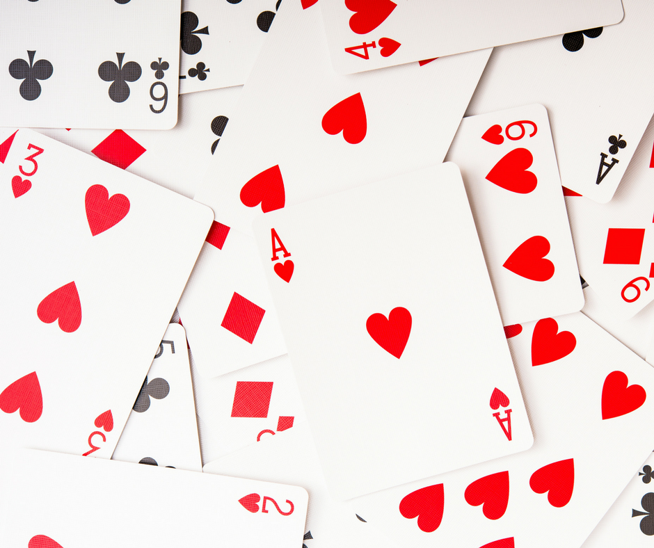 deck of cards spread out on table