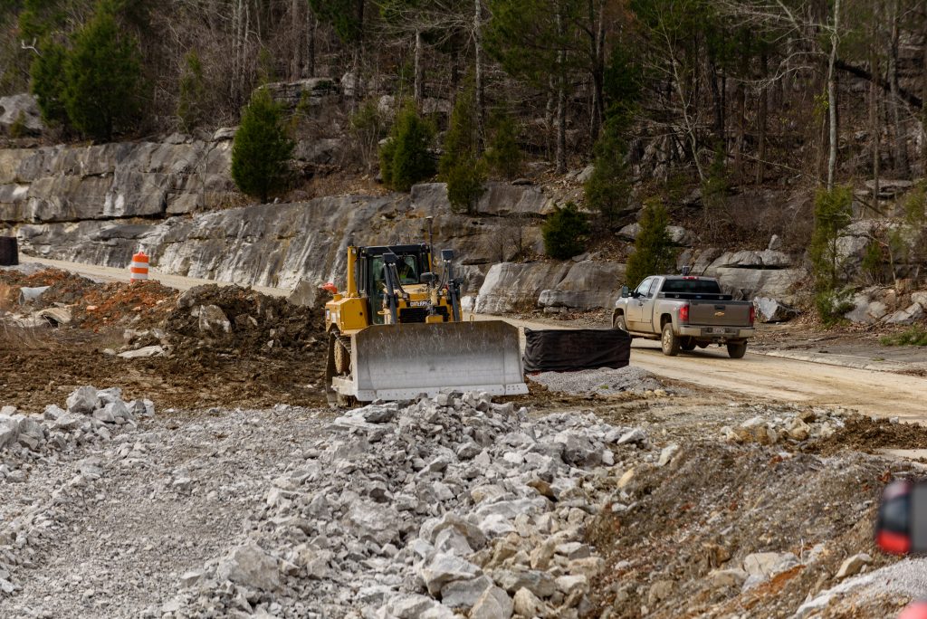 Bulldozer removes debris from work site