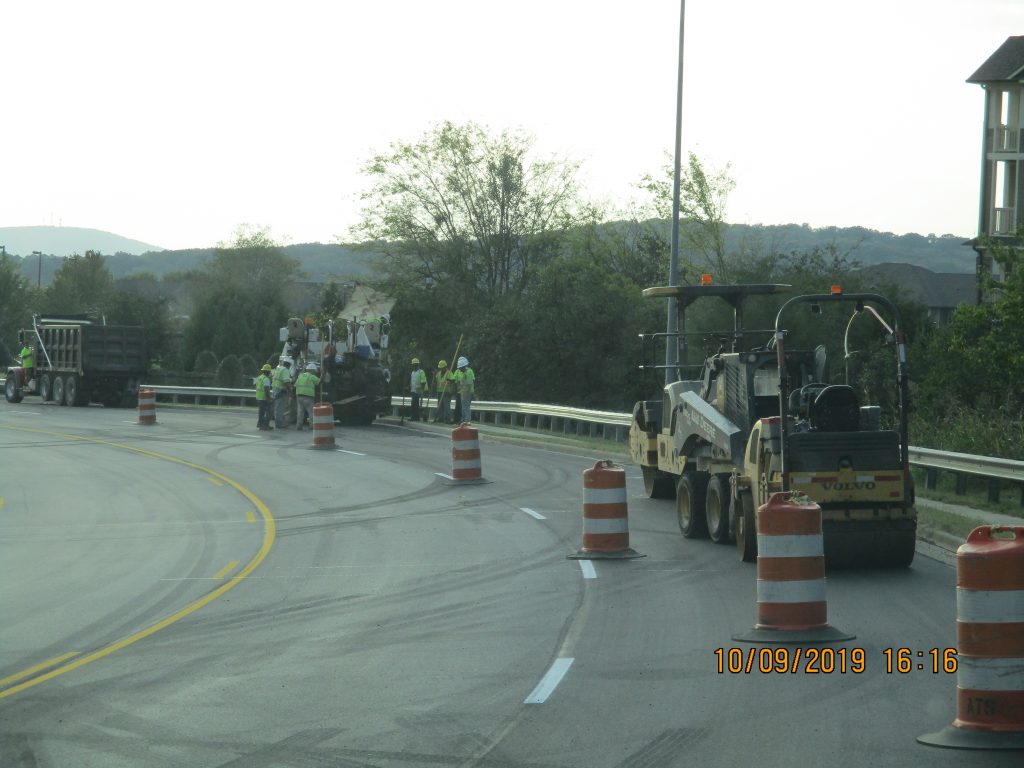 Tractors and construction workers on Cecil Ashburn