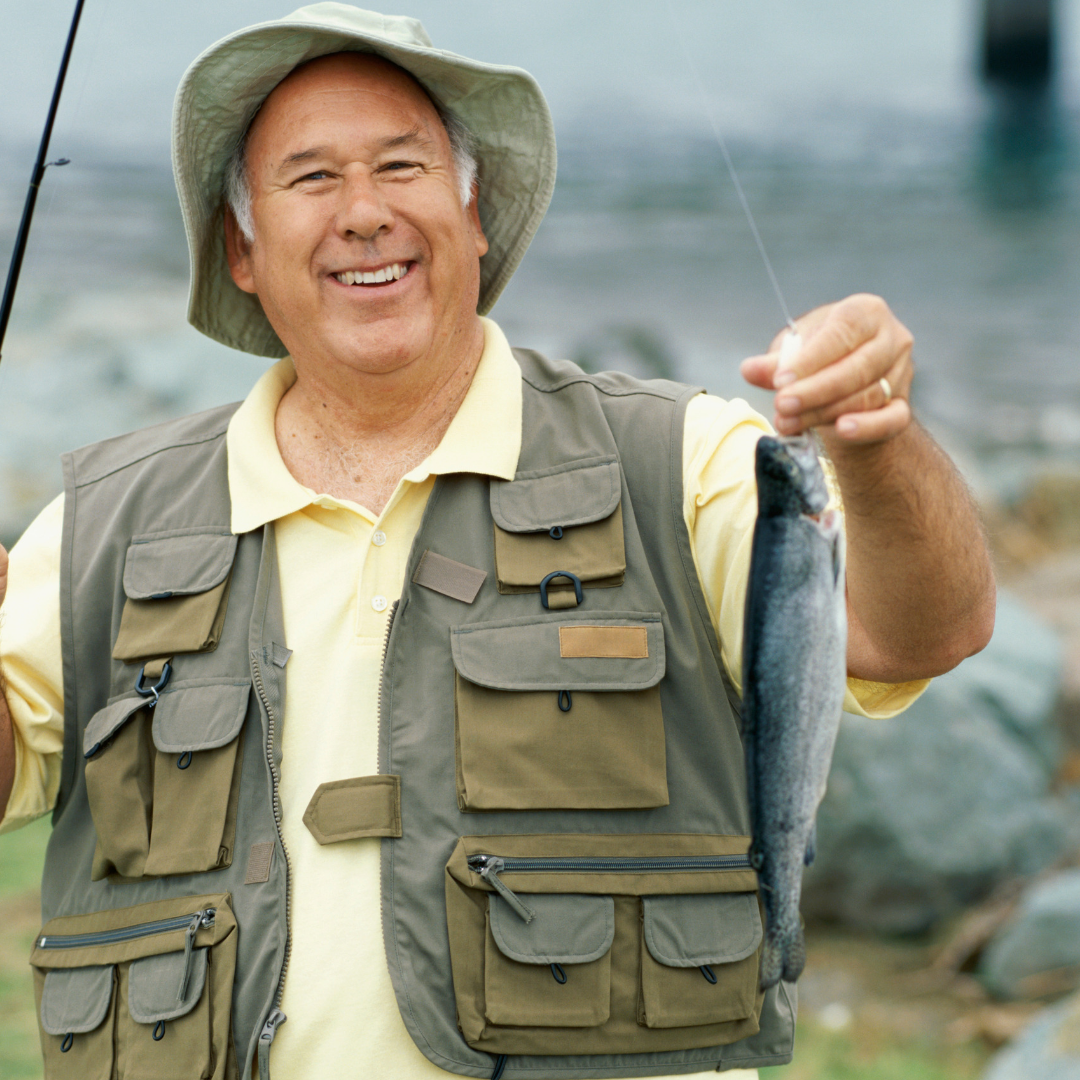 picture of man holding a fish