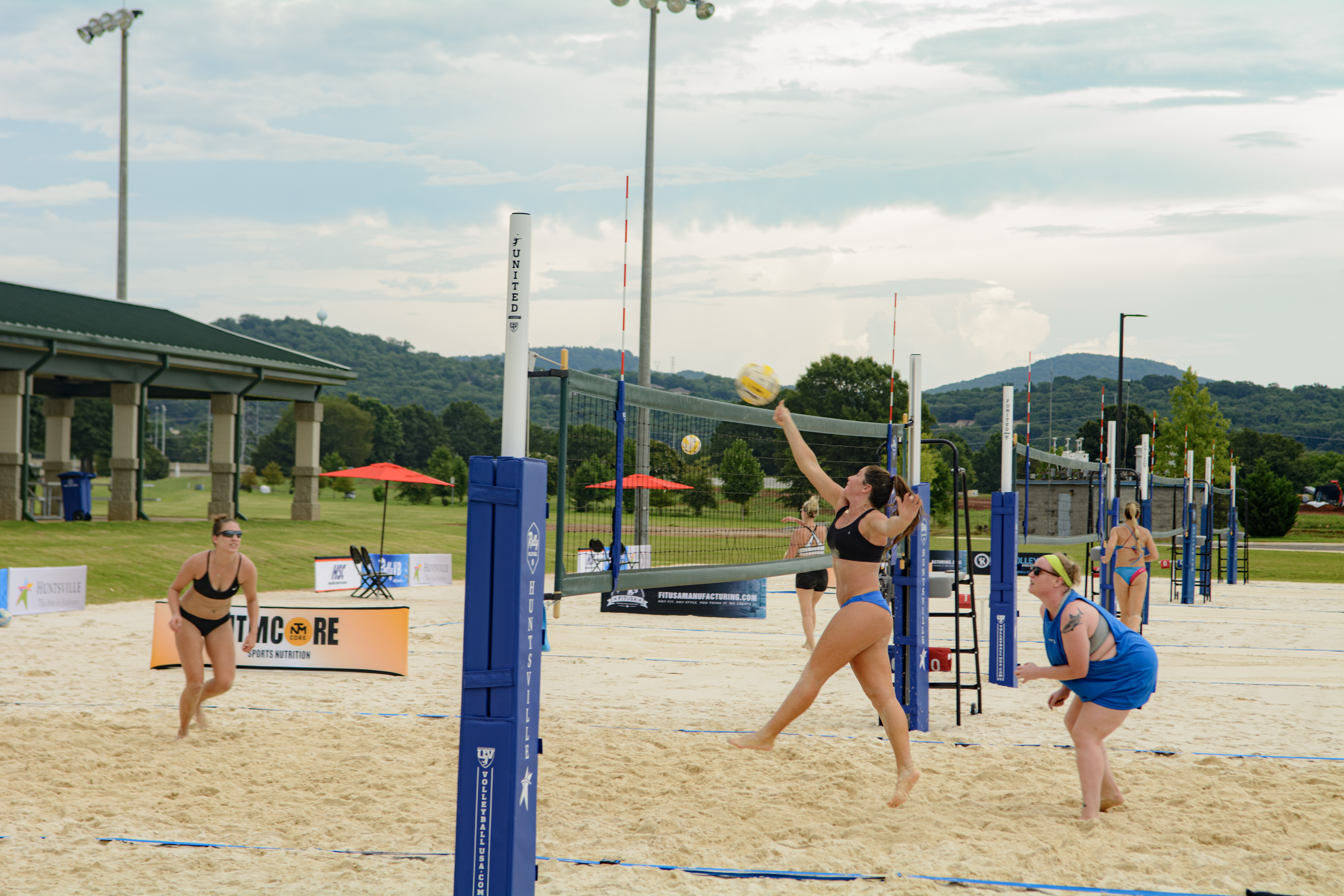Pictures of women playing sand volleyball