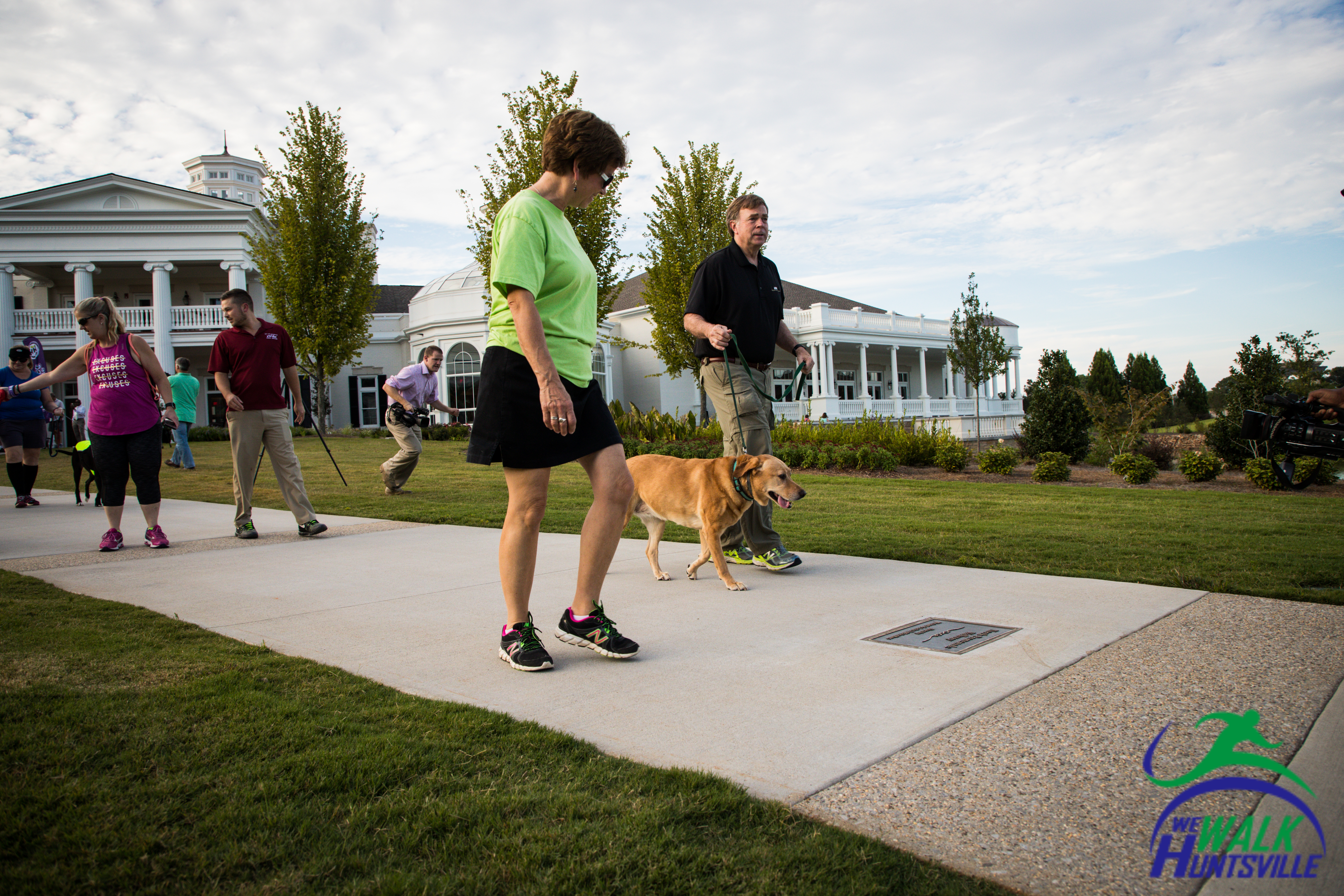 people walking their dogs at Huntsville Botanical Garden