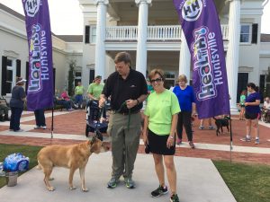 photo of mayor walking a dog at the Botanical Garden