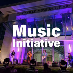 Music Initiative text over a photo of a band playing in from of the Huntsville Art Museum