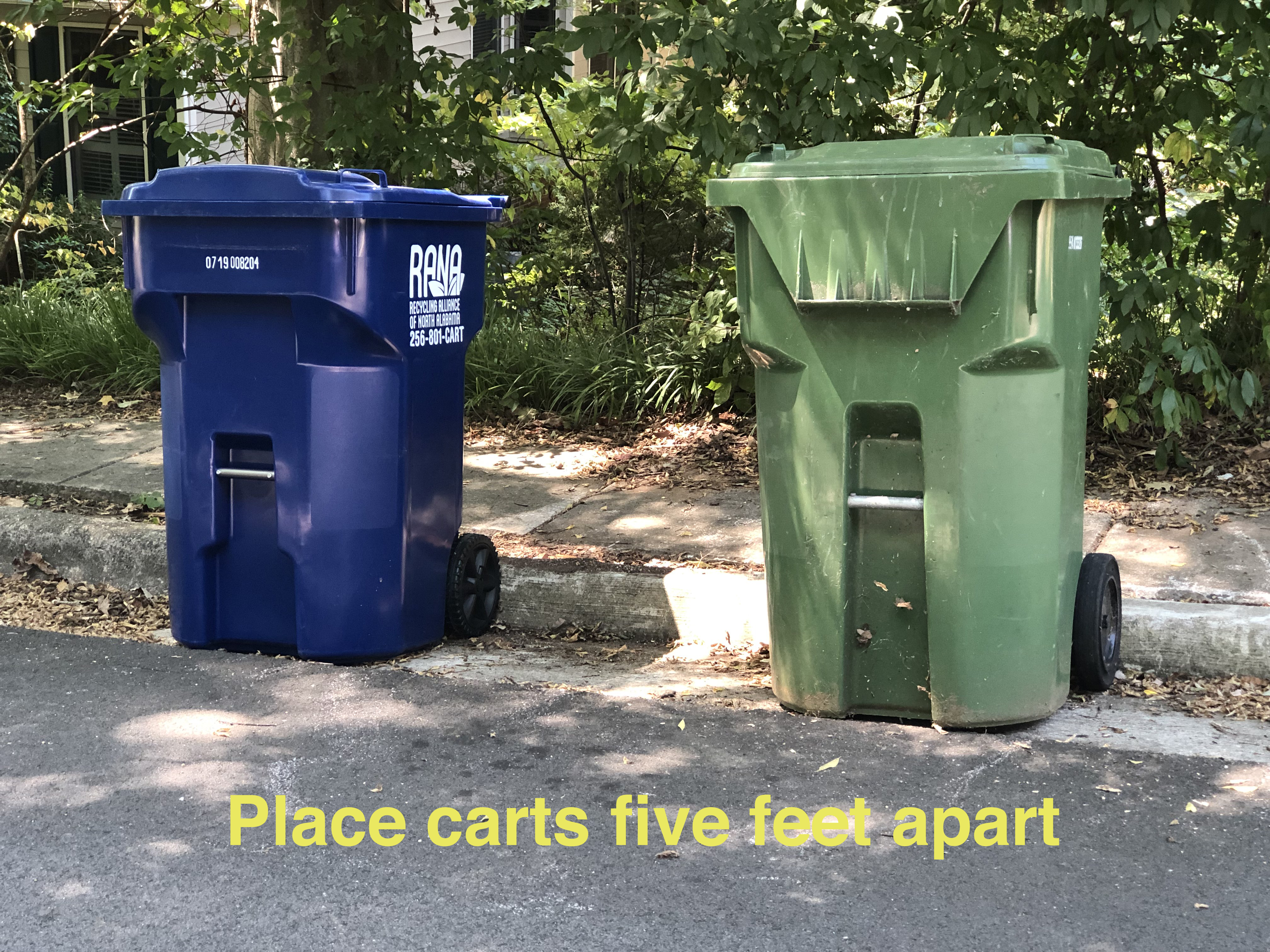 picture of trash carts parked on curb five feet apart