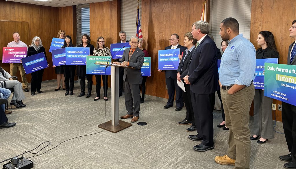 dozens of supports with support the 2020 Census signs
