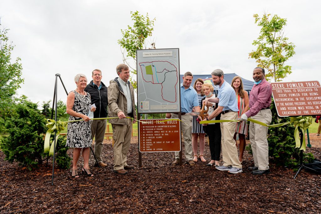 Photo of Fanning Family and Mayor Battle cutting the ribbon at the new park.