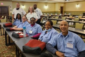 A group of bus operators pose for a photo at a statewide competition.