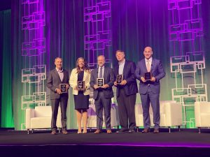 Mayor Battle receives an award on stage in Nashville for bringing broadband, fiber connectivity to Huntsville