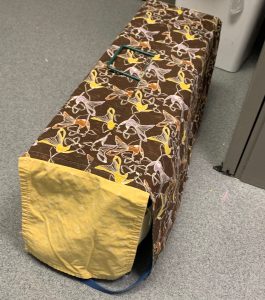 An example of the donated cat-trap covers in use by Huntsville Animal Services. The covers help keep cats calm after entering a trap.