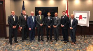 photo of eight of Alabama's big 10 mayors posed together in a conference room