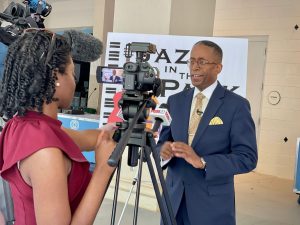 Kenny Anderson, Director of the City's Office of Equity, Diversity and Inclusion (ODEI), talks to the media about Jazz in the Park-Huntsville.