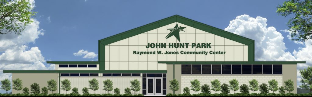 A rendering of the future Raymond W. Jones Community Center. The building is white with green trim.