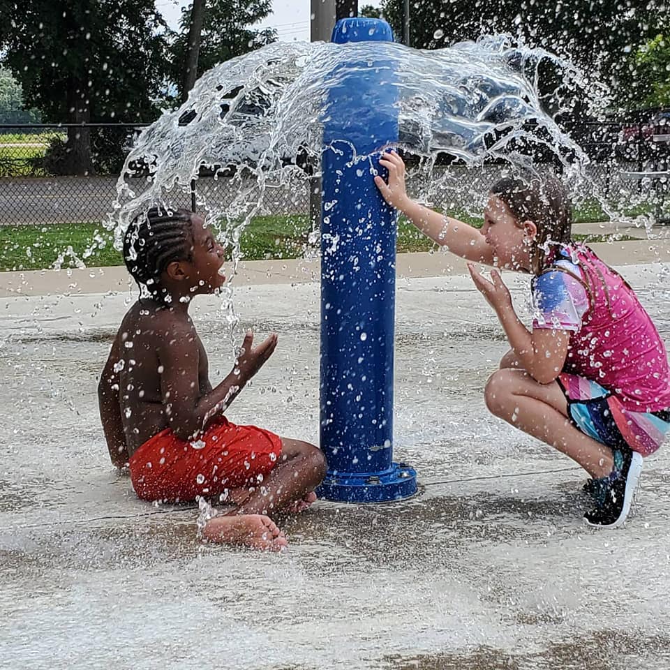 Children cool off at a City of Huntsville splash pad.