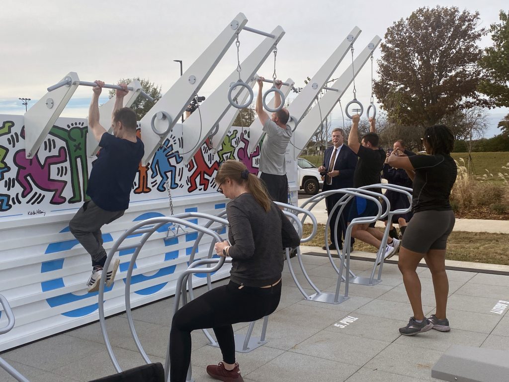 men and women working out on the new fitness court