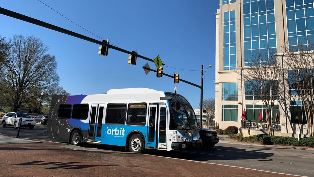 An Orbit shuttle is seen traveling through downtown Huntsville.