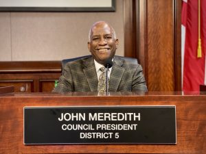 Man sitting behind a desk