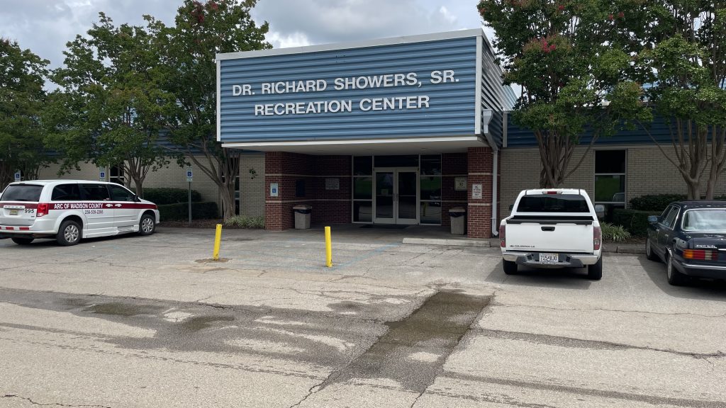 building with dr. richard showers, sr. recreation center on front with cars in parking lot