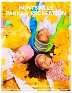 Cover of Huntsville Parks & Recreation's Fall Program Guide with a photo of three little girls wearing coats, and scarves laying on a bed of yellow leaves