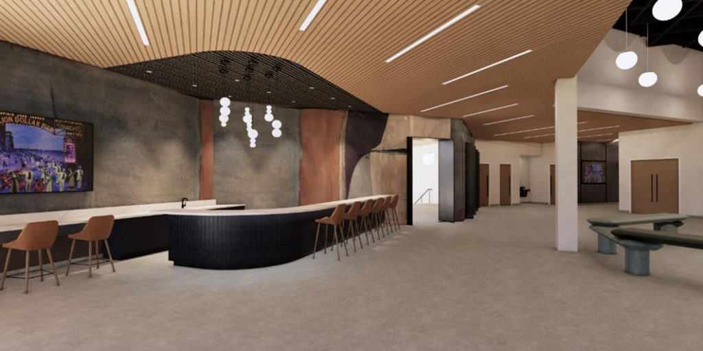 rendering of lobby space with a dais and wide walkways outside of theater