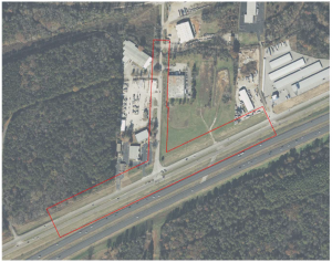 aerial view of highway intersection with construction area outlined in red
