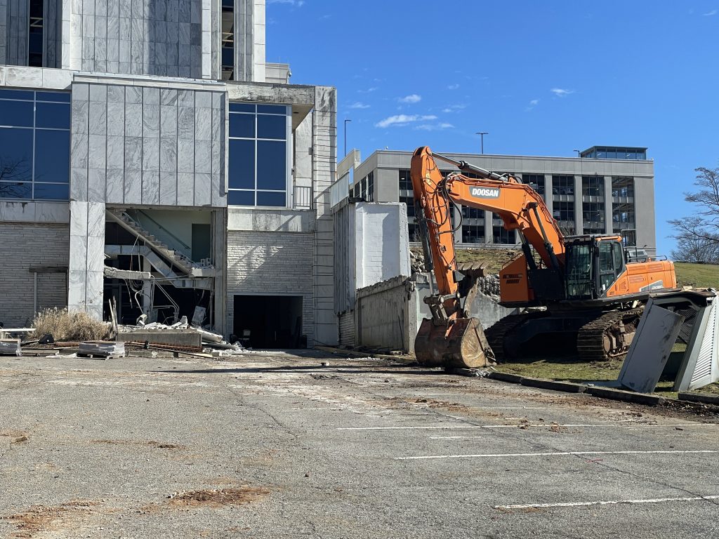 bottom part of building with heavy machinery on the right