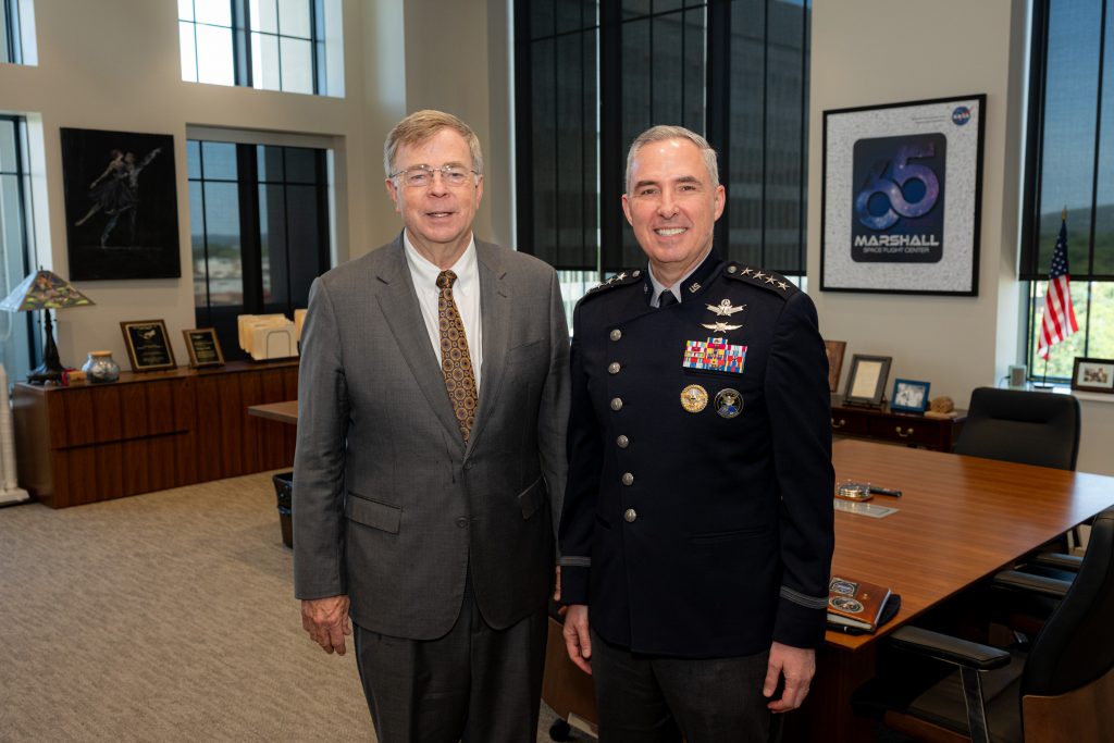Mayor and Space Command General pose in mayor's office during meeting at City Hall