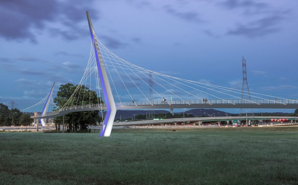 rendering of suspension pedestrian bridge in park setting