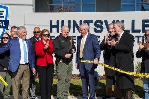 HPD Chief Kirk Giles, alongside Mayor Tommy Battle, City Council members and other HPD personnel cut the ribbon during a ceremony celebrating the construction completion of HPD's Crime Scene and Evidence Warehouse Complex.