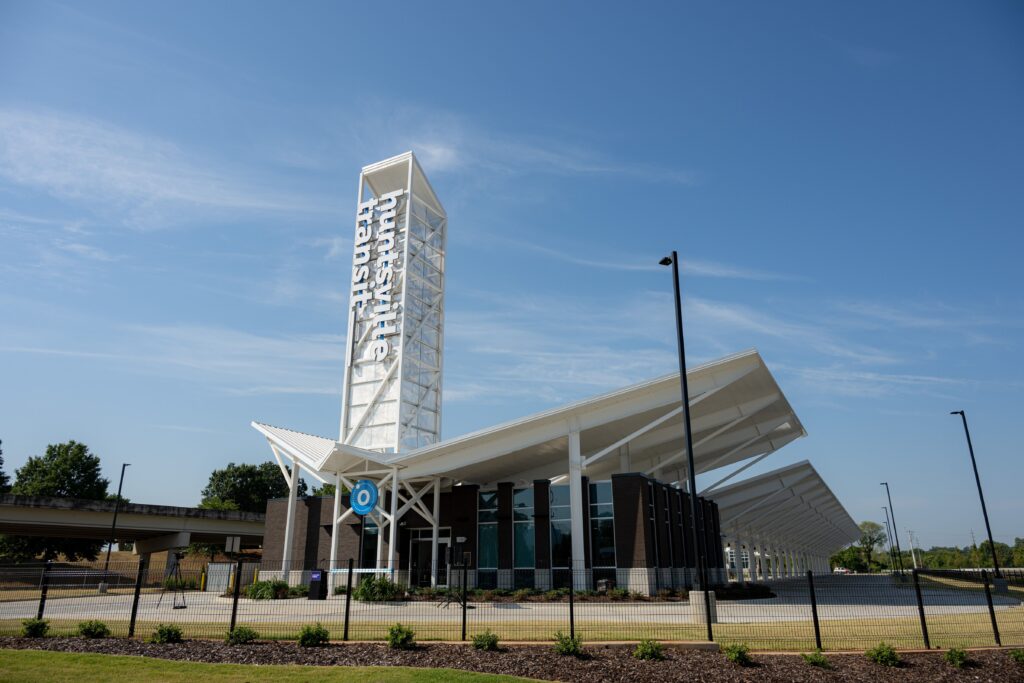 Huntsville Transit Center with tall white pillar sign that reads: Huntsville Transit