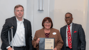 Mayor Tommy Battle with crutches standing next to CEA graduate Carol Gentz and former Director of Diversity, Equity & Inclusion Kenny Anderson