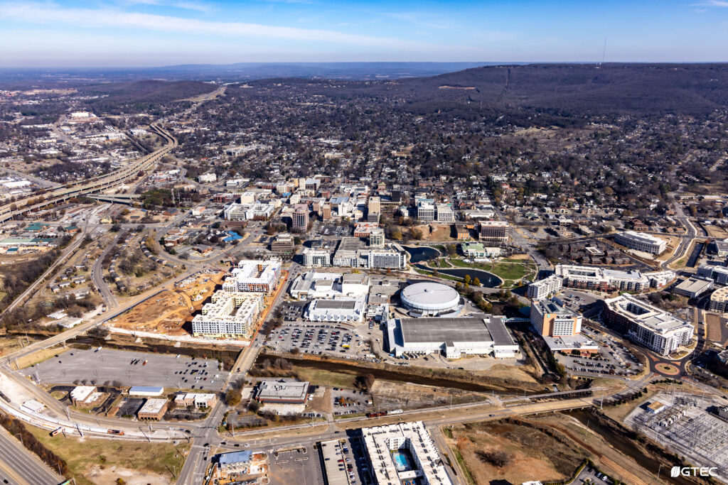 aerial view of city with mountains in background