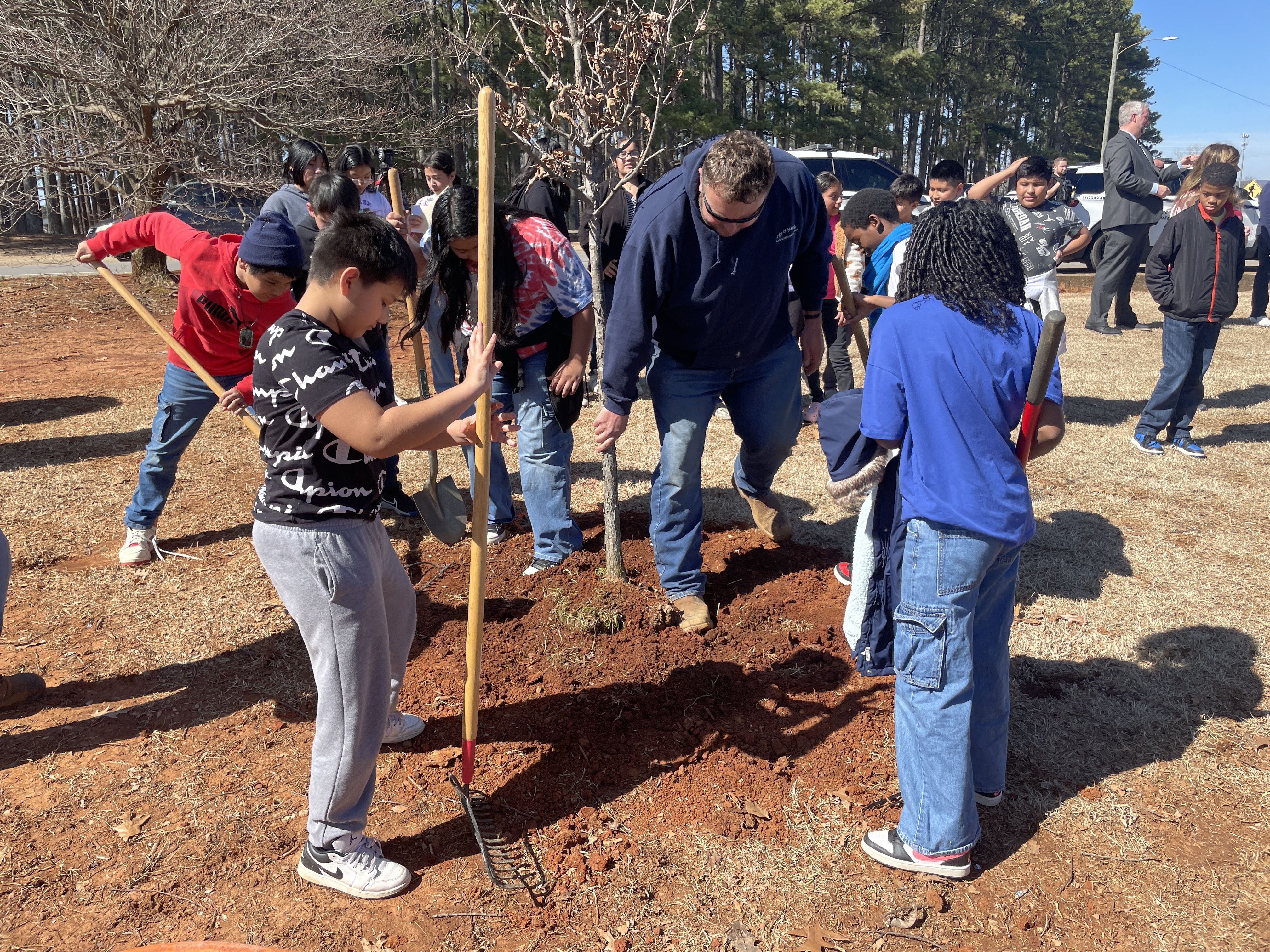 Students plant a tree during Arbor Day