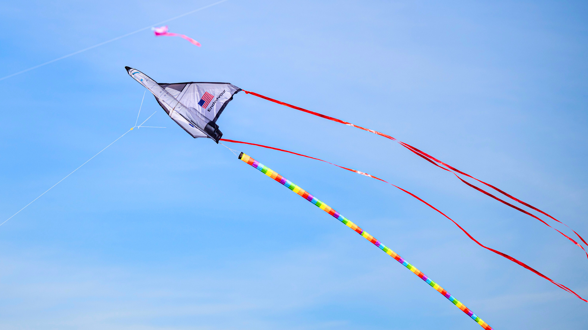 Rocket kite flying in front of a blue sky