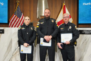 During the Feb. 12 City Council meeting, the Huntsville Police Department (HPD) honored Sergeant William Cunningham, Officer Douglas Morris and Officer Kristin Miller with Life-Saving Medals for their courageous actions on Dec. 5, 2025, when they rescued a man from frigid, fast-moving floodwater in north Huntsville.