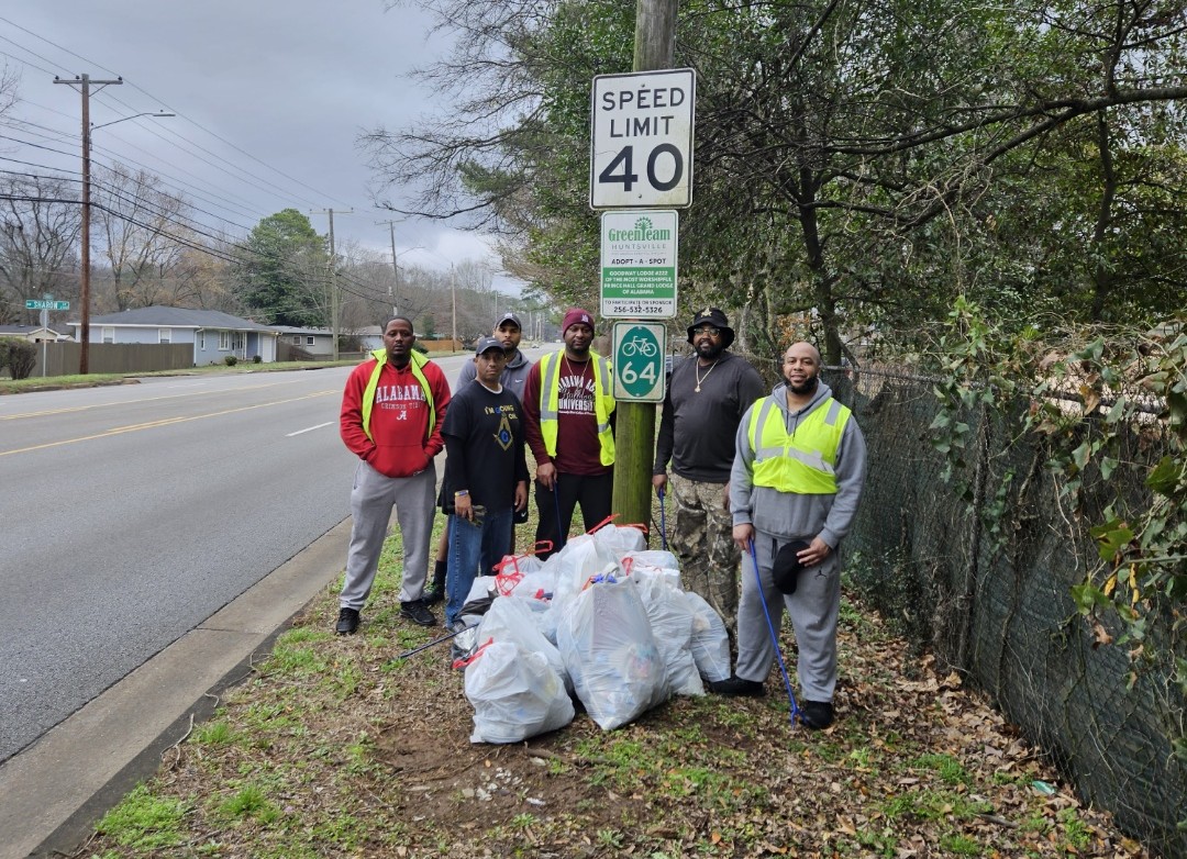 A group of six men volunteer to pick up litter along Oakwood Avenue