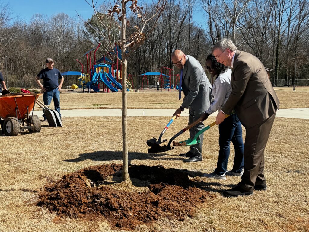 Mayor and community leaders planting a tree on Arbor Day