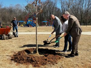 Mayor and community leaders planting a tree on Arbor Day
