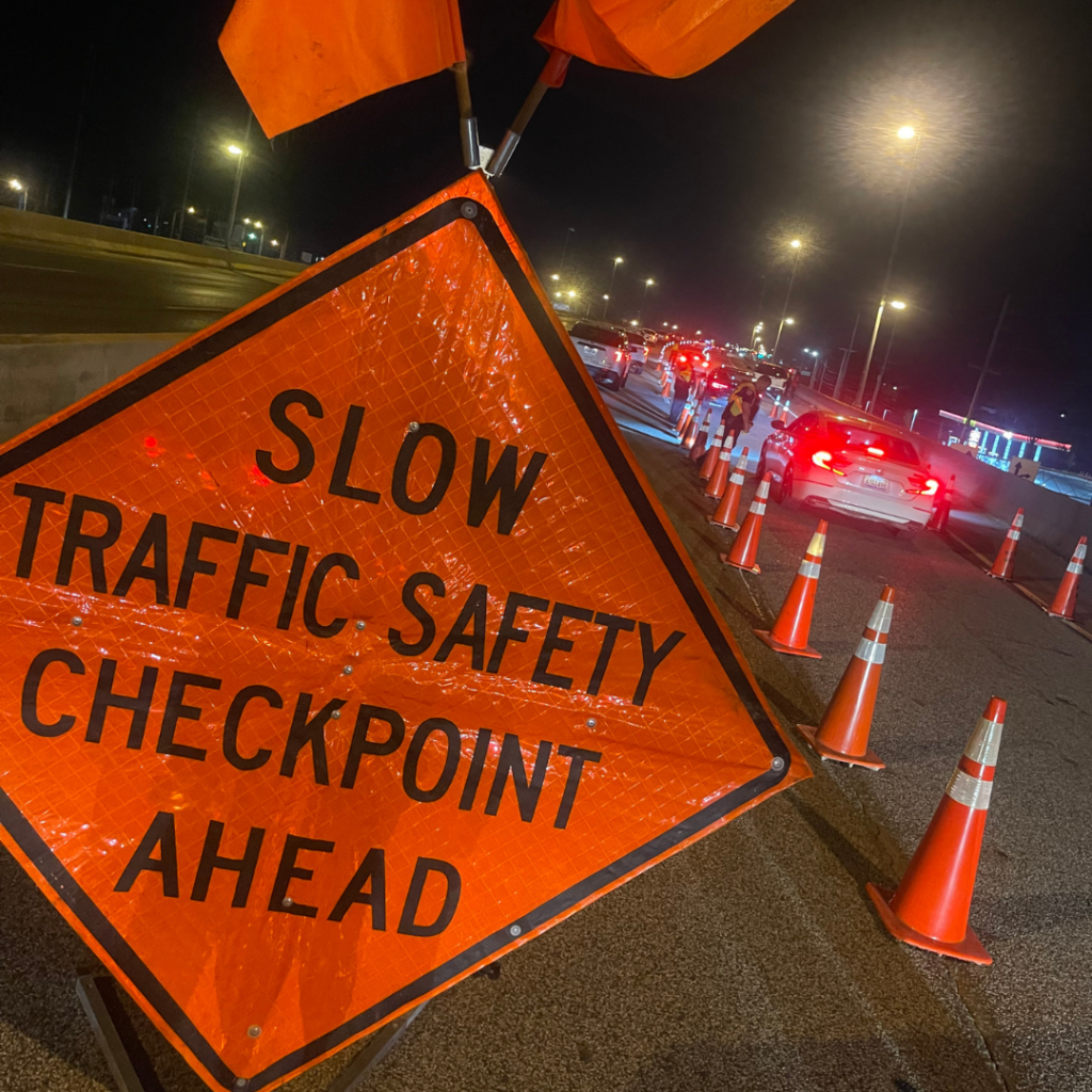 Orange traffic sign that says 