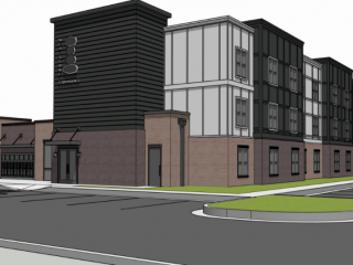A digital rendering of a modern building with a mix of brick, dark siding, and white paneling, featuring multiple windows and a prominent vertical sign with oval shapes and text.