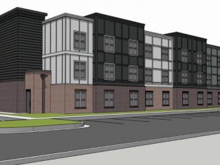 A digital rendering of a modern building with a dark gray, ribbed tower section and multi-story sections featuring dark gray and white paneling with numerous square windows. The lower level is brick with some windows and entrances with a parking lot.
