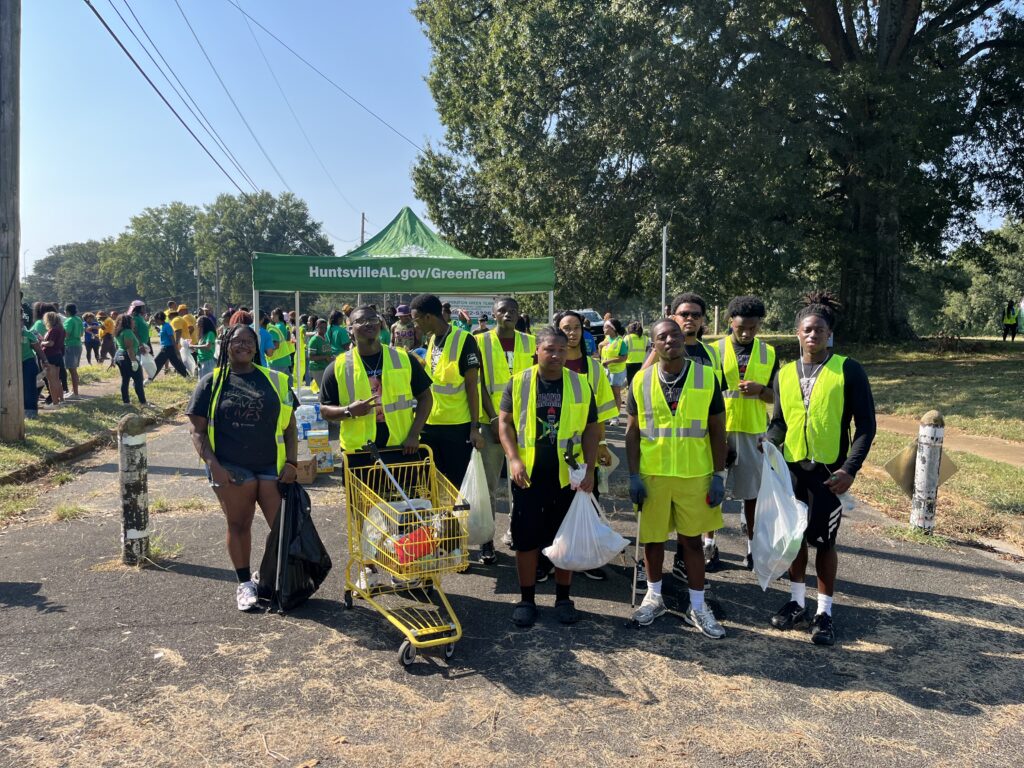 2026 National Cleanup Day group of volunteers in bright yellow vests