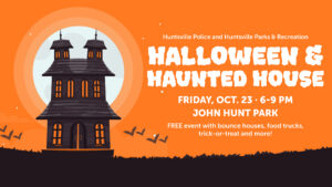 The image shows an illustrated graphic featuring a dark, cartoon-style haunted house set against a bright orange background with a large pale moon behind it. Several flying bat silhouettes appear near the bottom of the scene. Text on the right announces “Huntsville Police and Huntsville Parks & Recreation Halloween & Haunted House,” along with event details for Friday, Oct. 23 from 6–9 p.m. at John Hunt Park and a note about free activities including bounce houses, food trucks, and trick‑or‑treating.