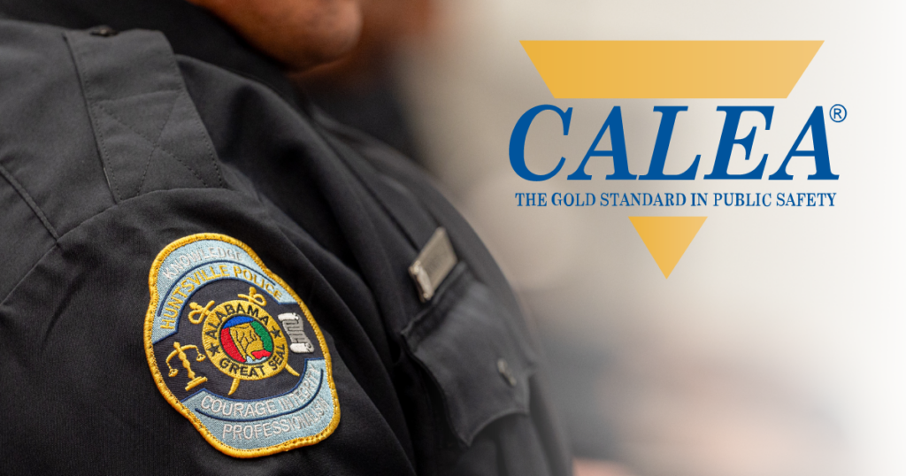 A close-up image shows the shoulder and upper sleeve of a dark uniform with a detailed embroidered patch for a police department. To the right, the CALEA logo appears with the tagline “THE GOLD STANDARD IN PUBLIC SAFETY” displayed on a light background.